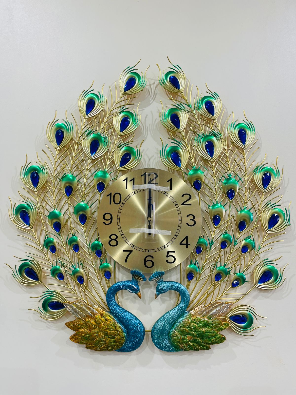 Bring elegance and beauty to your wall with this stunning Peacock Design Wall Clock.