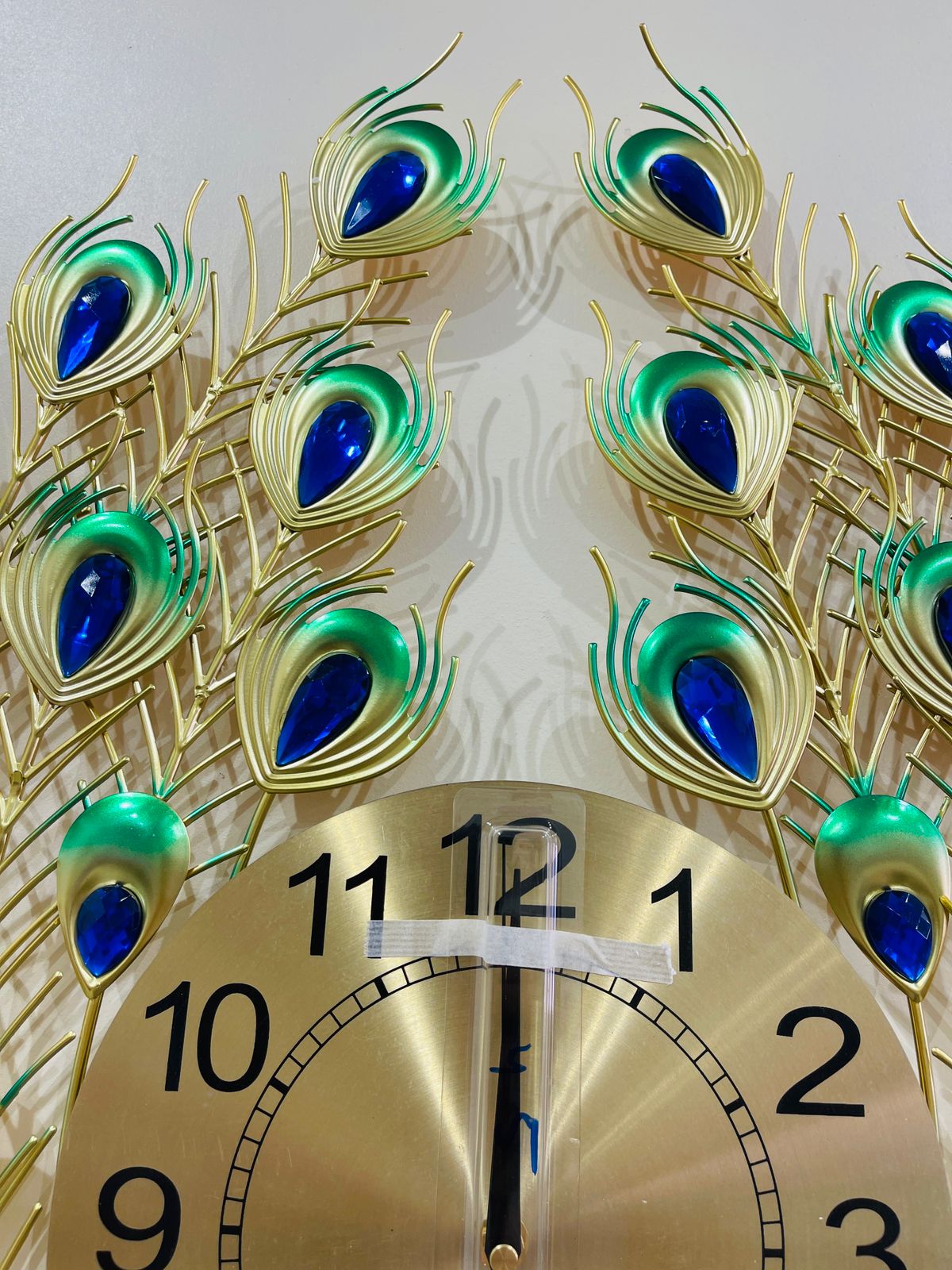 Bring elegance and beauty to your wall with this stunning Peacock Design Wall Clock.