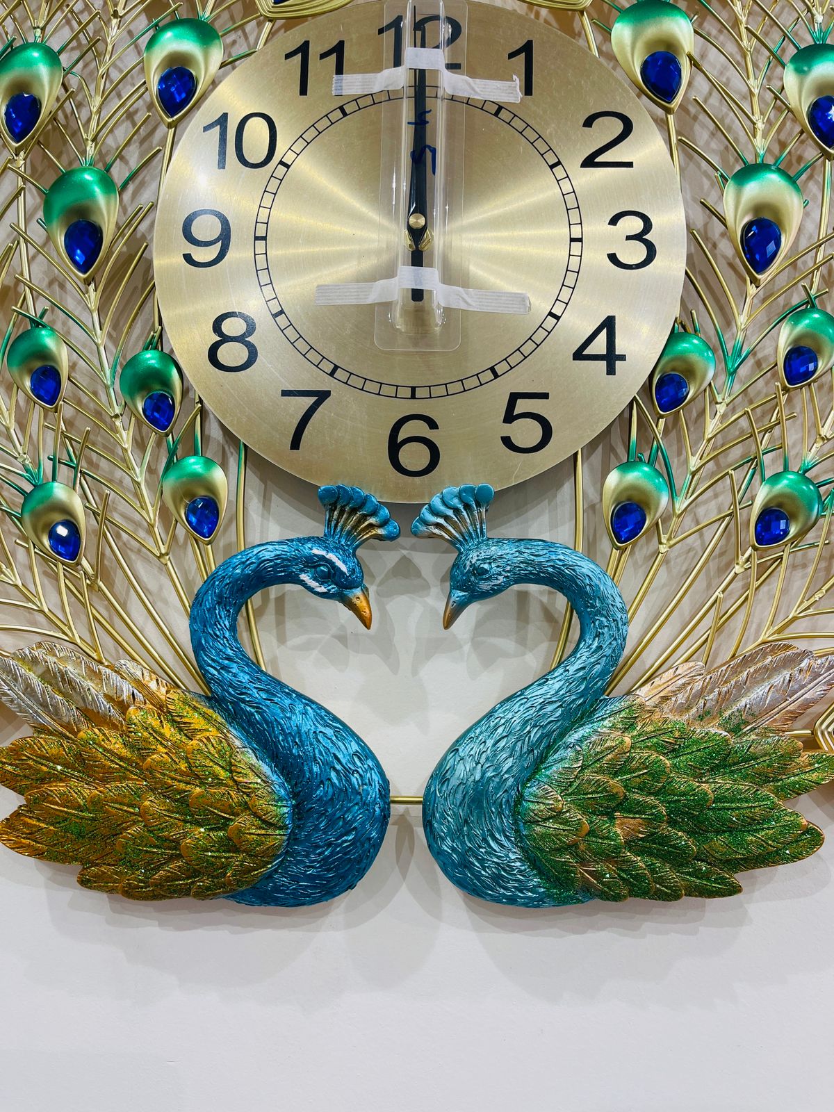 Bring elegance and beauty to your wall with this stunning Peacock Design Wall Clock.